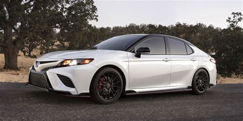 The 2022 Camry TRD takes vehicle handling and unique features even further. TRD-tuned shocks help enhance body control, handling agility, and steering precision in your Camry. A thicker underbody increases torsional rigidity, and unique coil springs drop the vehicle .60 inches for a lower center of gravity and enhance the aero kit for an .... 