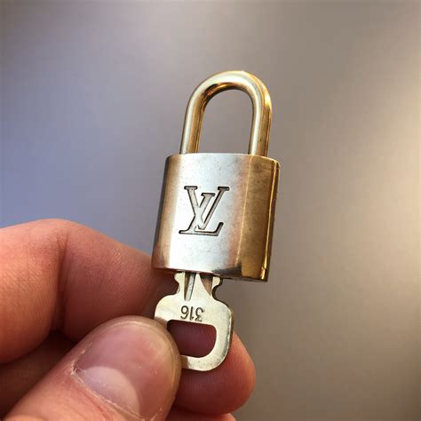 2023 Louis vuitton lock and key authentic padlock Gold 