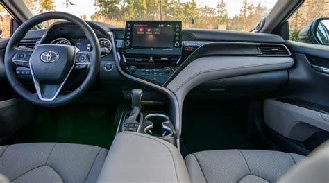 2023 camry interior. The 2023 Toyota Camry Hybrid impresses with a spacious and well-built cabin, an easy-to-use – though slightly outdated – infotainment system and a fairly large trunk. Lower trims have an excessive amount of visible hard plastics, but this Toyota’s interior has few faults overall. 