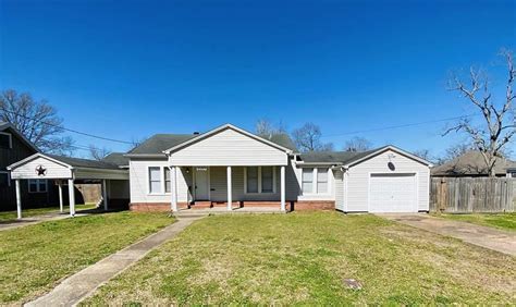 1110 johnson ave port neches tx  Easy to relax in this cozy living room, with its vaulted ceiling, bricked wood burning fireplace, and a beautiful exposed beam