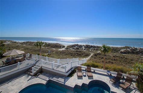 123 dune lane hilton head  Located 2nd row from the finest stretch of beach along the Atlantic Ocean, 17 Oyster Catcher is the perfect home for your next family vacation! This luxury home features 4-bedrooms and sleeps up to 14 guests