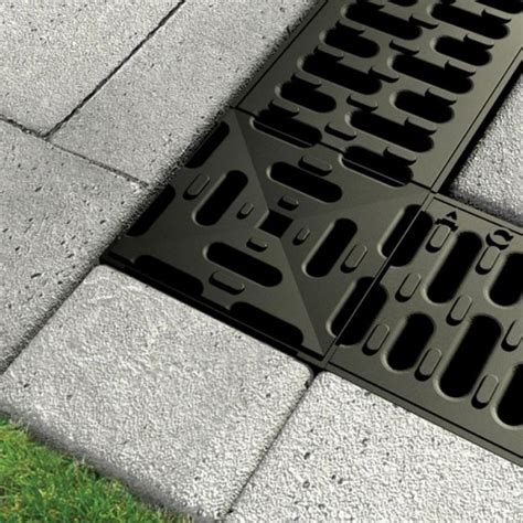 Aco drain corner  The corner unit bases are manufactured from Polyproylene, and supplied with either a galvanised steel grate, or a ductile iron grate top to complement the channels in the RainDrain range