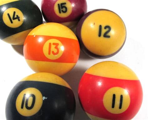 Bakelite pool balls 127 mm)] in diameter and weigh 5 ½ to 6 oz [156 to 170 gms]