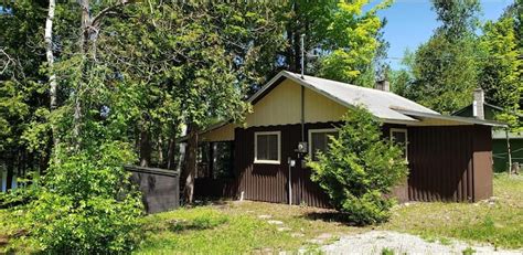 Black lake cabin rentals michigan  Floor to ceiling windows and a lofted second floor allow natural light and