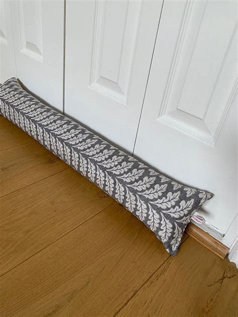 Draught excluder b&q  Evans Lichfield Mirror Stag Velvet Draught Excluder - Red