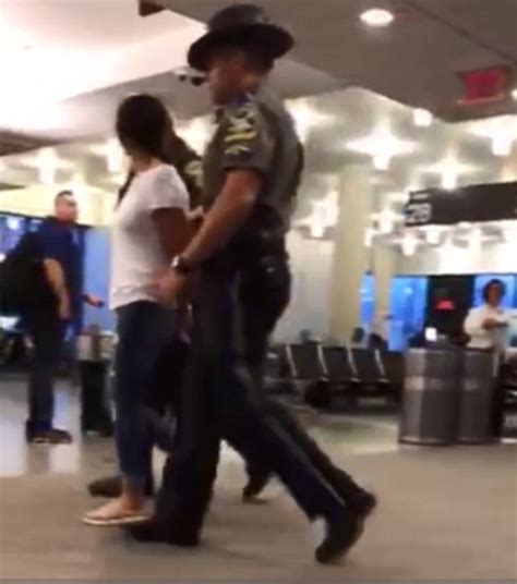 Drunk woman escorted out of airport The CCTV footage shows a blurred-out gesture that Boebert flashed at theater security as she was escorted out