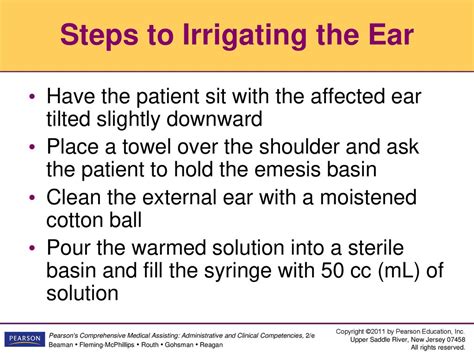 Ear irrigation definition  In one hand, hold the end of the IV tubing about 3 to 5 cm from the eye