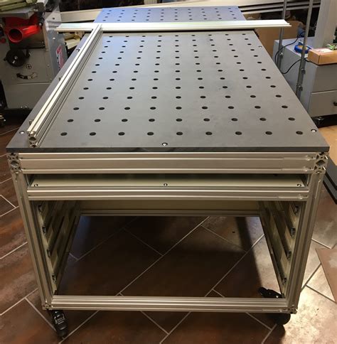 Extruded aluminum workbench  sidebar:I dumped my workbench after finally admitting that I never used it for anything but storage because my assembly table was just so much more convenient IMO