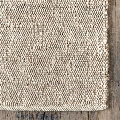 Helton handmade flatweave  With just a touch of ivory woven through it, this 100% natural wool pile rug will be a cozy