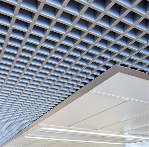 Hunter douglas open cell ceilings  T15 tiles are made from roll formed U-profiles and fitted with a cover strip that visually