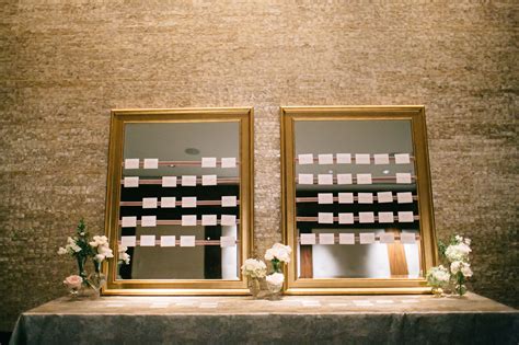 Mirrored escort card display <samp> At that point, they might discover a place card bearing their name or be free to choose their preferred seat</samp>