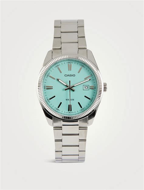 Mtp1302d 2a2v  This timeless simple silver watch features a stunning turquoise blue dial that is complemented by luminous hands