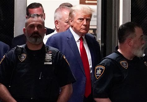 Photos of trump with escorts  President Donald Trump is shown in a police booking mugshot released by the Fulton County Sheriff's Office, after a Grand Jury brought back indictments against him and 18 of his allies