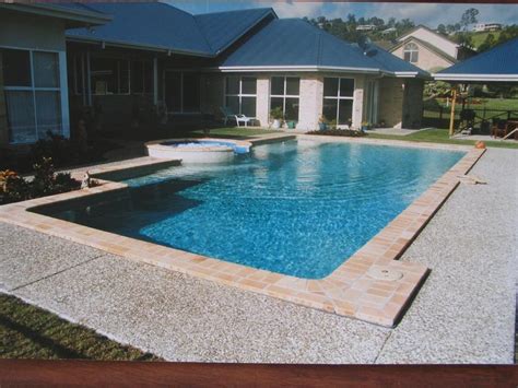 Pool builders cairns  This can be as simple as timber decking or incorporate a sloping earth feature, BBQ area or be