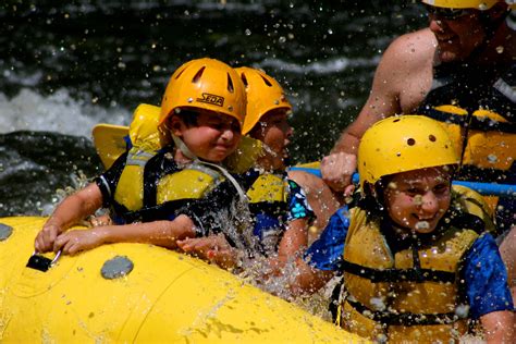 Rafting in the smokies discount code Rafting in the Smokies/Family Adventure is a log building with a red tin roof