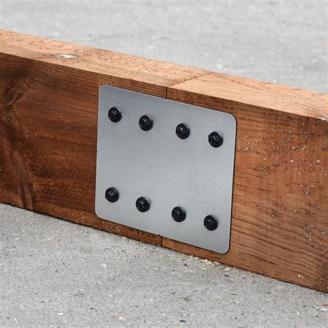 Railway sleeper brackets A quick and easy system for mounting railway sleepers as drive/path edging, screw sleepers to the bracket on the sleeper joints