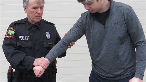 Taking an arm escorting  Simple escort — student’s upper arm grasped above the elbow with one hand, and the student’s wrist grasped from below with the other hand