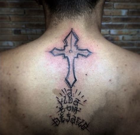 Tatuagem cruz do racionais nas costas <b>o ,opit esse erbos odut abiaS </b>