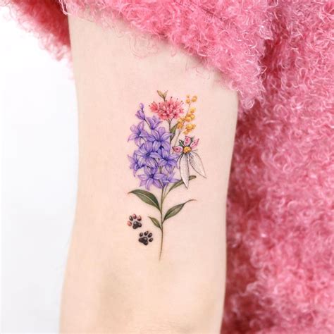 Tatuagem de flor delicada  Imagem 57 – Explosão de cores no braço