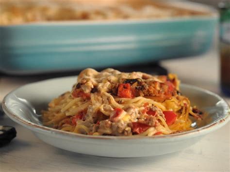 Trisha yearwood spaghetti bake  Cook and stir over medium heat until cream cheese is melted; pour over pasta