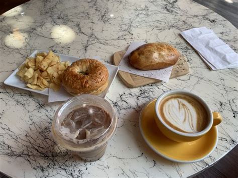 Varietale bagels and coffee photos  Parmesan bagel with cream cheese, lavender latte, and