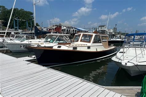 Wasque 32  The interior features a useable galley with a Force 10 propane 2 burner stove, Dometic RM 2354 refrigerator, Tappan TM4040S microwave oven, ISO Temp SQ 16V Hot water heater, and a Xantrex Tru 20 battery charger, an enclosed Jabsco Marine head with