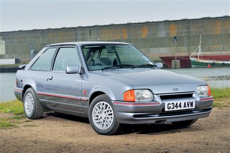 What kind of ford escorts are there  It should likely be recharged with the same, or have a shop fully empty the unit, and check it for compatibility with the later freon