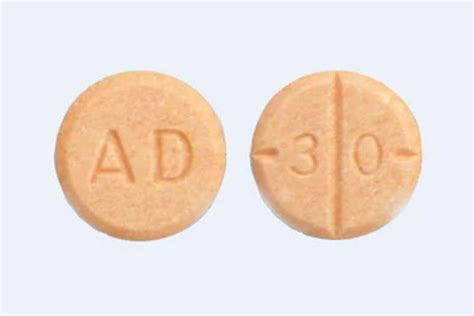 ad30 orange pill In contrast, authentic Adderall 30 mg tablets produced by Teva are round, orange/peach, and scored tablets with "dp" embossed on one side and "30" on the other side of the tablet