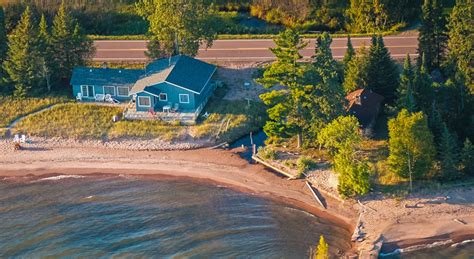 apostle islands vacation rentals  A rocky shoreline suddenly reflects the world around you