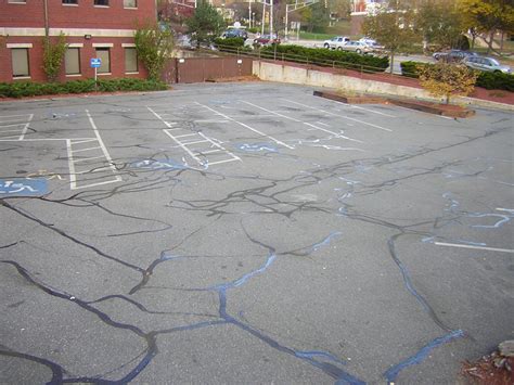 atlanta parking lot crack repairs contractor How To Repair a Catch Basin: Saw Cut and remove Concrete/Asphalt around catch basin