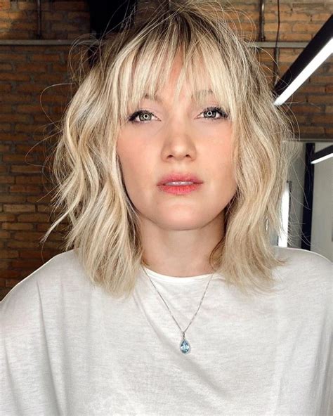 choppy lob with side bangs  Below-the-Chin Bob With Wispy Arched Bangs