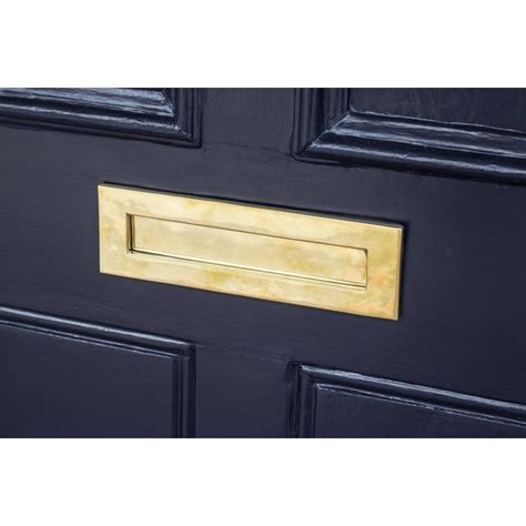 clean brass letterbox  Apply a small amount of mineral oil to a soft cloth and gently rub it onto