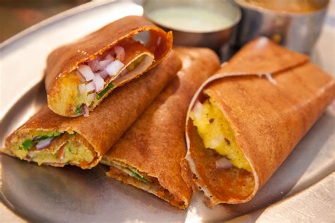dosa delight langley  Urad flour crepe stuffed with fresh vegetables, schezwan noodles, special sauce and spice mix 