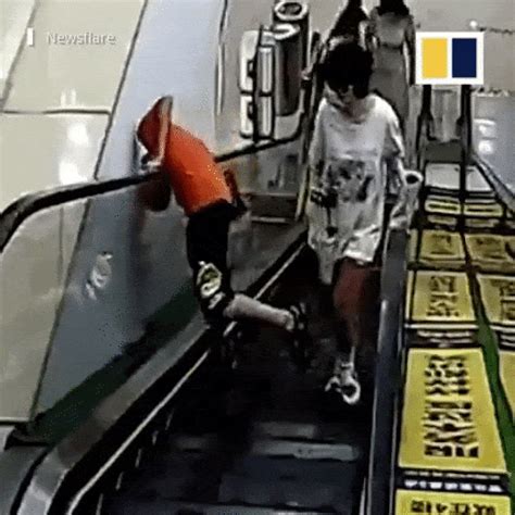 escalator accident gif m