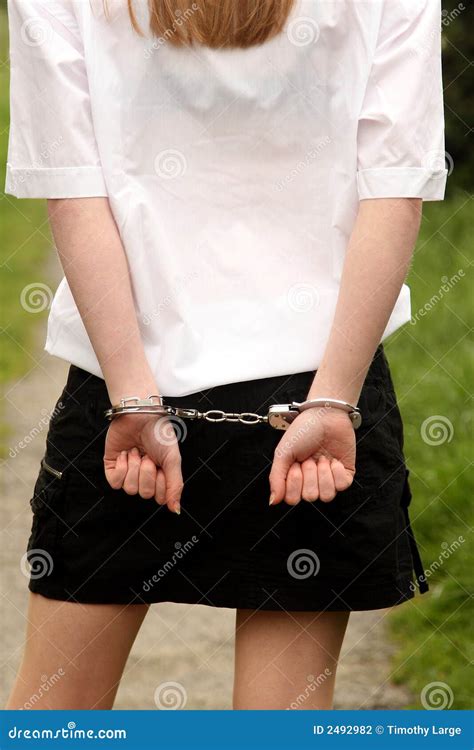 Hot sexy ass in panties and hands with handcuffs backview isolated on white  background. Sexy, hot
