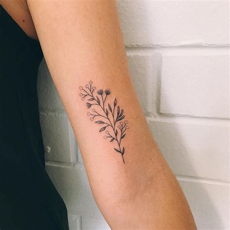 fine line australian native flower tattoo  The delicate veneer of iris flowers flaunts a tender ethereal appeal