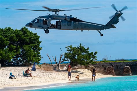 helicopter to dry tortugas , hoisted the men into the aircraft and transferred them to Key West International Airport in good health