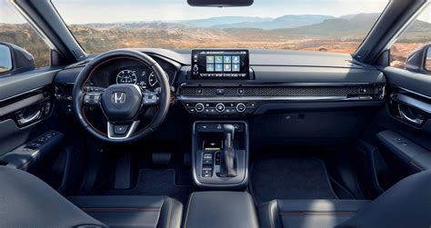 The 2024 Accord shares its interior styling cues with the recently redesigned Honda CR-V and Civic. The dashboard features a horizontal layout with a distinctive mesh grille that hides the air vents. The dashboard features a horizontal layout with a distinctive mesh grille that hides the air vents.. 