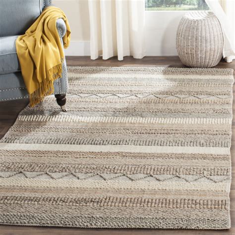 jacques striped handmade flatweave area rug in beige  by Breakwater Bay