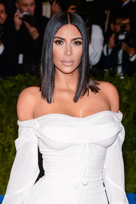 Kim Kardashian Paired a Plunging Scoop Neck Bodysuit With Hip Bone