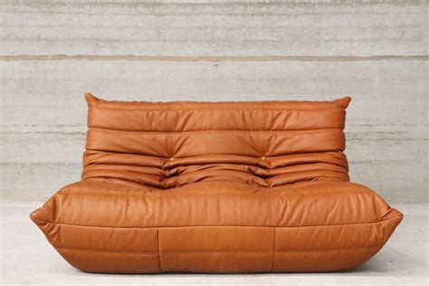 michel ducaroy The TOGO sofa, designed by Michel Ducaroy (1925-2009), looks like a cushioned seat that instinctively makes you want to wallow in it or settle comfortably, depending on your mood