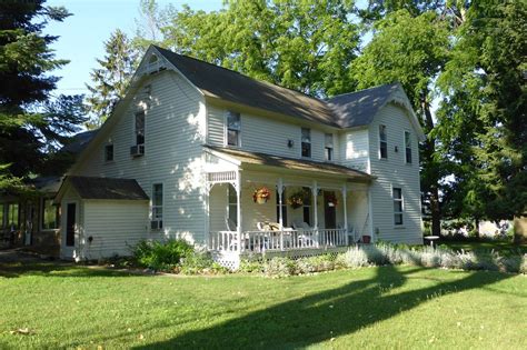 places to stay in empire mi  Manning Memorial Lighthouse on the shore