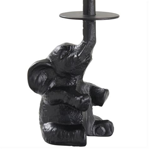 wilko elephant toilet roll holder  STURDY DESIGN - Crafted from weighty cast iron, this standing toilet paper holder has enough heft to remain stable when you pull towels from it