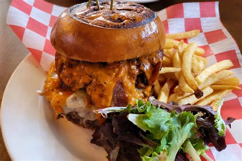 21 burgers and wings. Smoked Macaroni and Cheese Burger. $19.99. Smoked gouda macaroni and cheese bites, smoked gouda cheese, smoked bacon, and house-made campfire sauce. Thumb up. 94% (51) Quick view. 