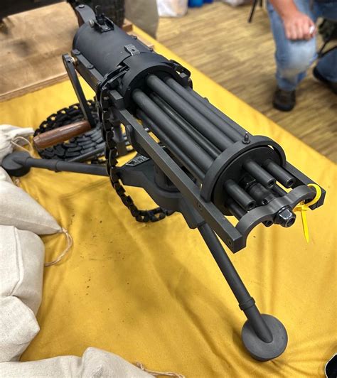 The gun is permanently attached to its tripod via blind rivets. The traverse and elevation mechanism is technically removable. It allows precise adjustment to the gun on the tripod. The belts consist of individual polymer links that snap together. Charging belts with .22LR cartridges is quick, easy, and painless.. 