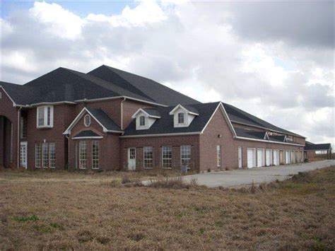 In the small city of Pearland, Texas lies two huge abandoned mansions on adjoining lots. The larger of these properties (which this post will focus on) is 60,175 square feet in size, features 46 bedrooms, 55 bathrooms, an indoor swimming pool, and a 9 car garage. To the locals, it's known as the Manvel Mansion.