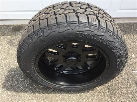 The 275/55R20 tire measures approximately 31.9 inches tall an