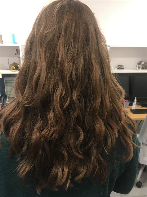 2a wavy hair. Routine: wash 2-3 times per week with Lidl brand, sulfate free shampoo and conditioner. Finger comb and squish curls with conditioner in wet hair. Rinse almost all conditioner out. Apply DevaCurl Wave Maker cream with prayer hands and squish before plopping with microfiber hair turban for 30 minutes, then air dry. 
