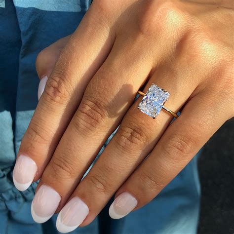 3 carat radiant cut diamond ring. Princess cut 3-carat diamond: 7.9mm x 7.9mm x 5.7mm; Asscher cut 3-carat diamond: 8mm x 8mm x 5.3mm; Heart shape cut 3-carat diamond: 9.5mm x 9.5mm x 5.7mm; Marquise cut 3-carat diamond: 15mm x 7.5mm x 4.5mm; Pear cut 3-carat diamond: 13mm x 7.8mm x 4.8mm; Radiant cut 3-carat diamond: 8.3mm x 8.3mm x 5.3mm; Pros and Cons for a Vintage 3 Carat Ring 