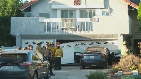 3 injured after Tesla driver loses control, smashes into garage in San Fernando Valley